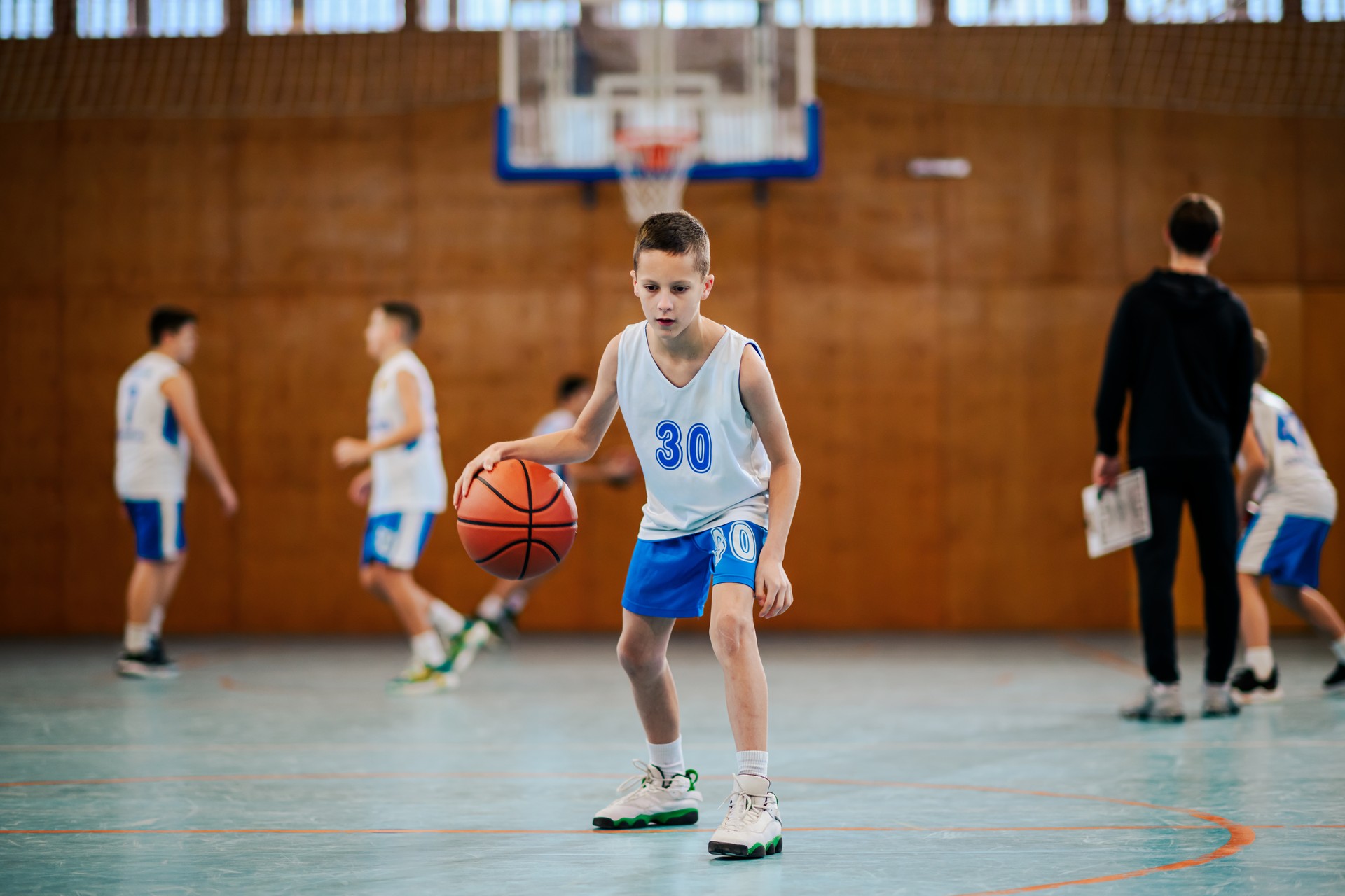 Young athlete dribbling basketball